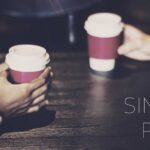 Business partners having take away coffee